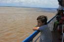 Sailing past the meeting of the waters.: The black water from the Rio Negro and the Brown from the Solimoes take several kilometers to mix together.